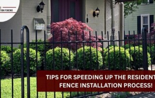 Black metal residential fence with decorative tips in Bryan, Texas.